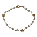 Pulsera infantil,  perlas y corazónes.